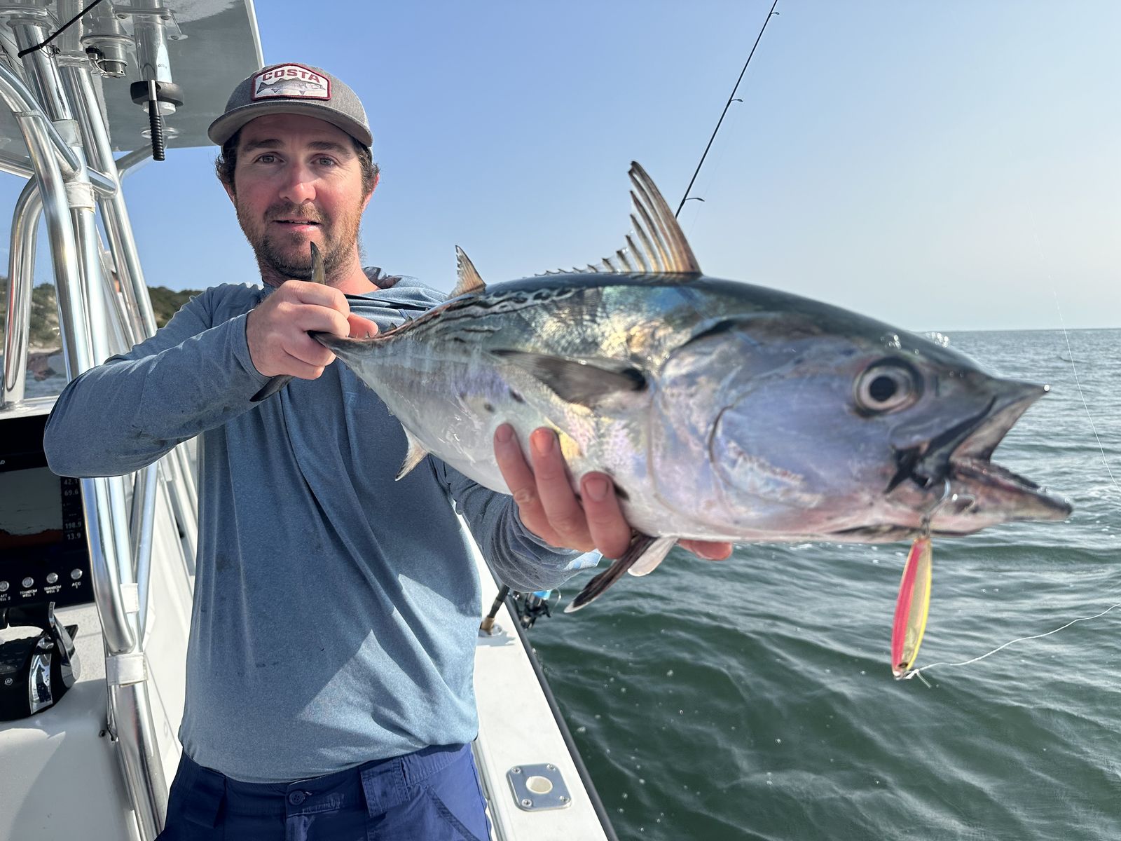 Angler with a big false albacore on a Cape Cod fall-run charter
