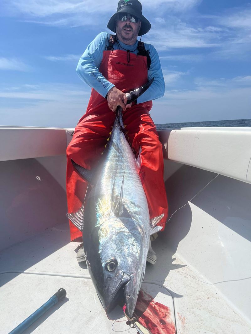 Angler with a huge bluefin tuna caught jigging offshore of Cape Cod